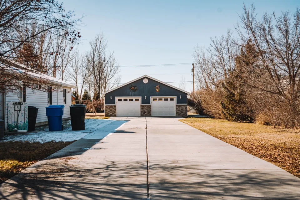 Representative residential concrete driveway and home